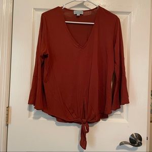 Veronica M, burnt orange color, medium. Excellent condition.